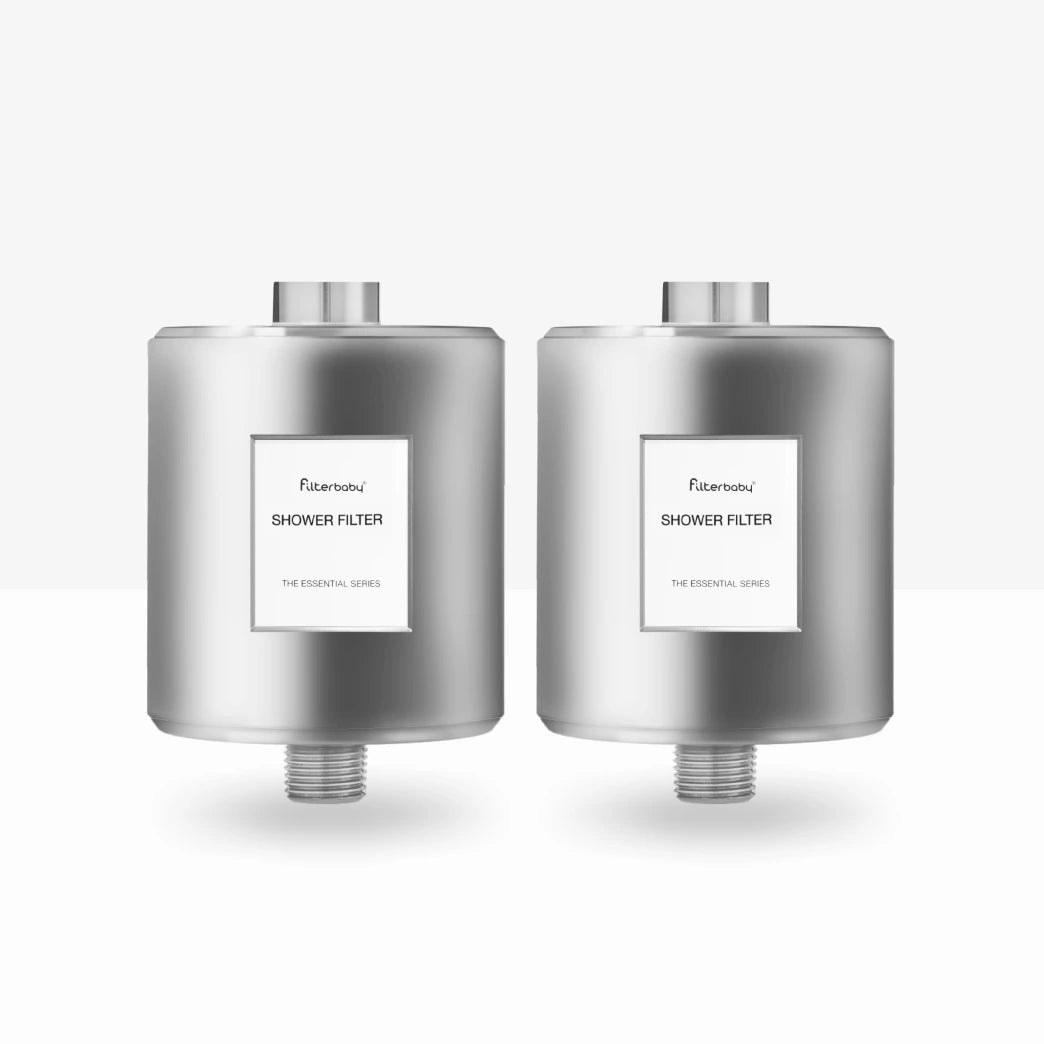 Two silver shower filters with labels on a white background